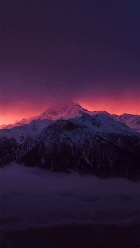 Snow Covered Mountains Peaks Fog Under Purple Black Cloudy Sky 4k Hd