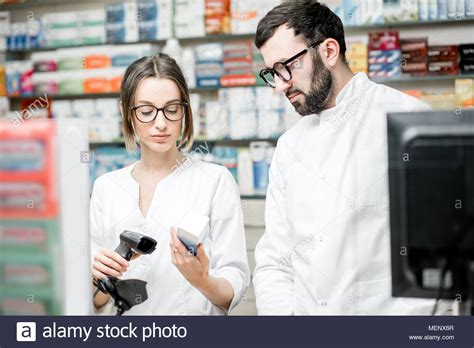 Pharmacists Working In The Pharmacy Store Stock Photo Alamy