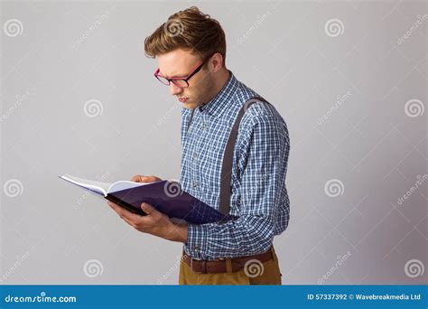 Geeky Student Reading A Book Stock Photo Image Of Side Concentrated