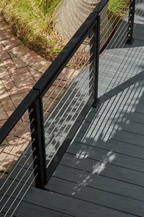 Our railing posts and caps come standard in aluminum, which is highly recycled/recyclable. Miami Oceanside Deck With Black Cable Railing | Viewrail