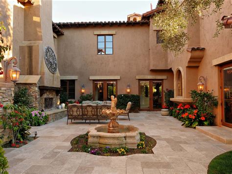 This beautiful rolling hills ranch home boasts a stunning courtyard with tranquil fountain and a grape vine trellis. Pin by Peter Elana Primbetov on Оutdoors | Courtyard design, Spanish style homes, Courtyard ...