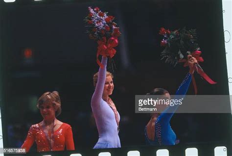 Denise Biellmann Of Switzerland Wearing Gold Medal And Waving Bouquet