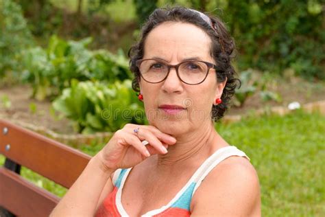 Portrait Of A Middle Aged Brunette Woman With Eyeglasses Outdoor Stock