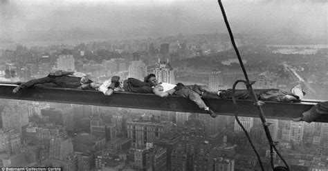 Construction Workers Resting On A Steel Beam Above Manhattan During