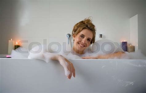 Woman Smiling In Bathtub Stock Image Colourbox