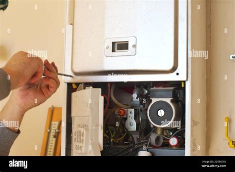 Man Engineer And Gas Heater Repair And Work Scene Stock Photo Alamy