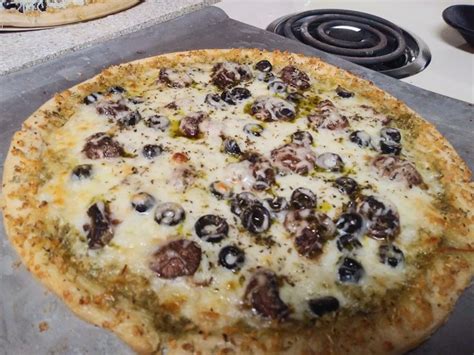 Mushroom Olive And Basil Pesto Pizza With A Rosemary