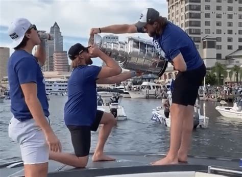 Tampa bay lightning victory rally & boat parade. Steven Stamkos chugs beer out of Stanley Cup at boat ...