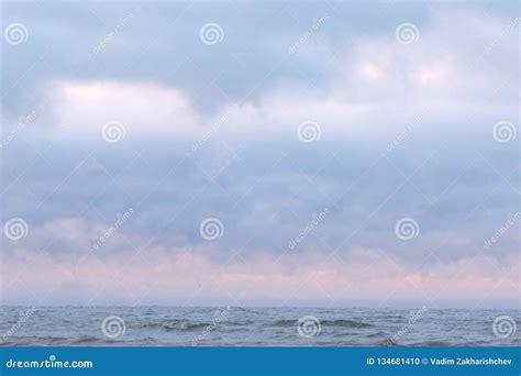 Mist And Fog Over The Sea Beautiful Seascape With Pink Sunset And Blue