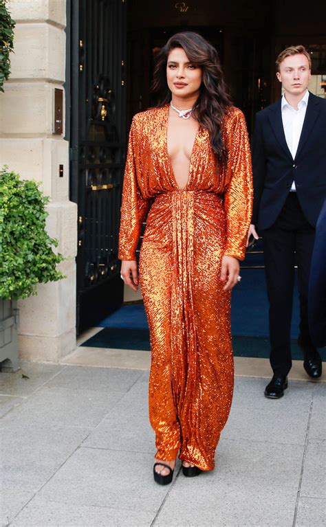 Priyanka Chopra Sizzles In A Plunging Orange Dress As She Leaves Her Hotel In Paris Photo