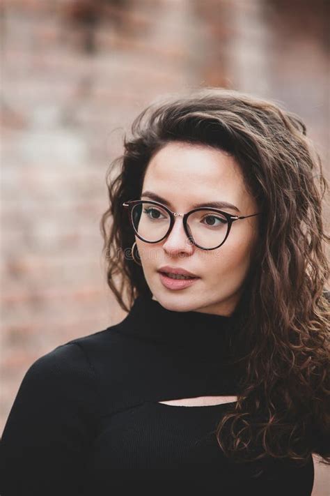 Beautiful Young Woman With Brunette Curly Hair Portrait In Eye Glasses Enjoying The Sun Stock