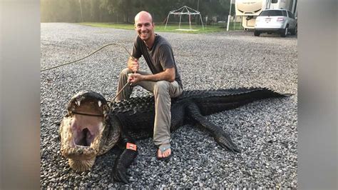 Once In A Lifetime Two Boaters Reel In A Massive One Eyed Alligator