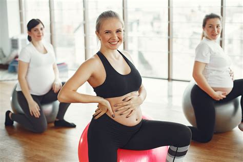 Group Of Pregnant Women Doing Exercises On Fit Balls · Free Stock Photo