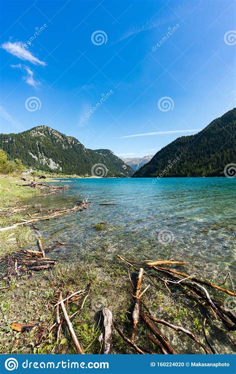 Idyllic And Picturesque Turquoise Mountain Lake Surrounded By Green