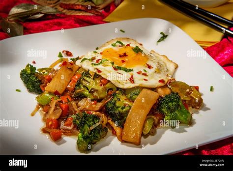 Canned Chinese Food Chop Suey With Fried Sunny Side Up Egg Stock Photo