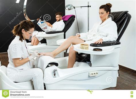 Young Woman Doing Pedicure In Salon Beauty Concept Stock Image