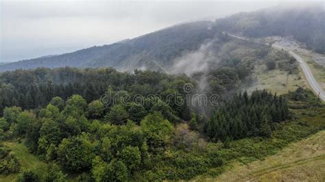 Aerial View Of Mountain Road In The Fog Stock Photo
