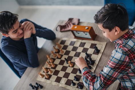 Two Boys Playing Chess In School Of Chess Stock Photo Download Image