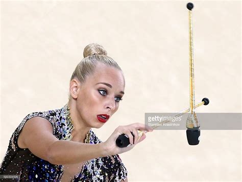 Russias Athlete Yana Kudryavtseva With Clubs In The Rhythmic Summer Olympic Games