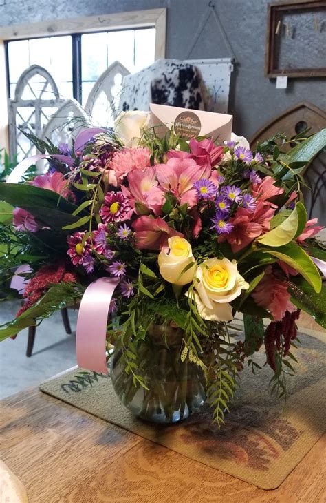 Check spelling or type a new query. Mixed flower arrangement pink flowers in a vase flowers in ...
