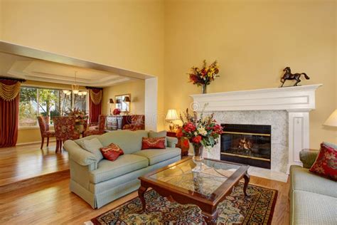 Elegant Living Room Interior With White Fireplace And Flowers Stock