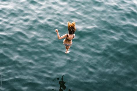 Woman Diving Into Water By Stocksy Contributor Simone Wave Stocksy