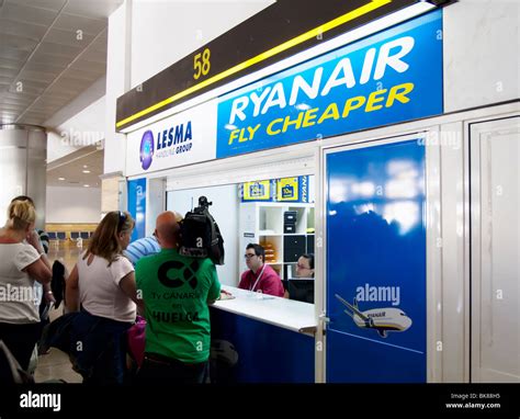 Passengers At Ryanair Office In Gran Canaria Arport Being Filmed By Local Tv Crew During
