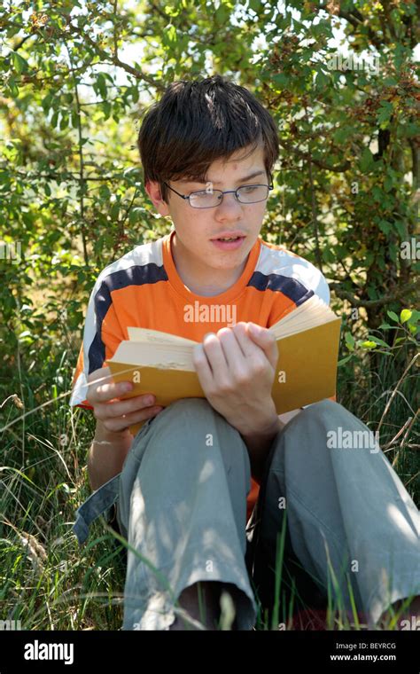 Portrait Of A Teenage Boy Reading A Book Stock Photo Alamy
