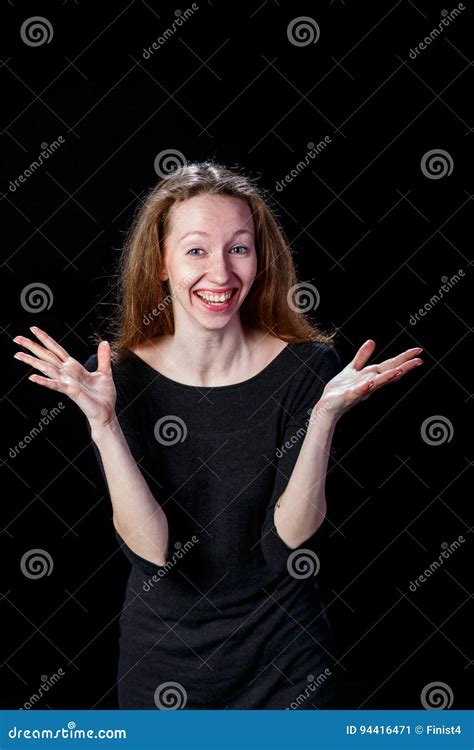 Cheerful Young Woman Smiling Spreading Her Hands To The Sides Stock
