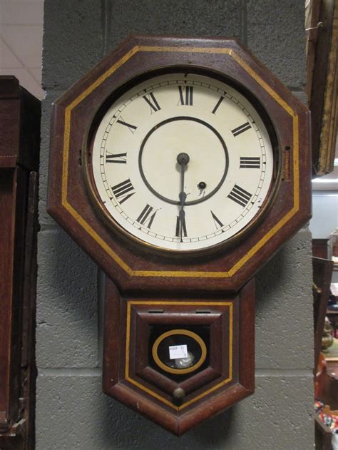 An American Wall Clock A Mantel Clock And Folding Wind Up Gramophone
