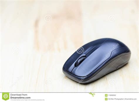 Computer Wireless Mouse On Wood Table For Business Education And