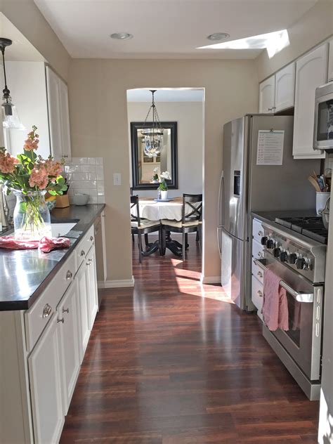 Galley kitchen can define as a large, small kitchen that has two sides of counters and a straight walkway between it. A Small Kitchen Tour | Galley kitchen design, Galley ...