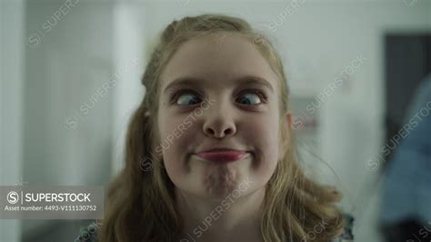 slow motion close up of girl making funny faces at camera lehi utah united states superstock