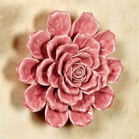 Take this set of hanging wall art: Isabella Ceramic Flower Blossom Wall Art