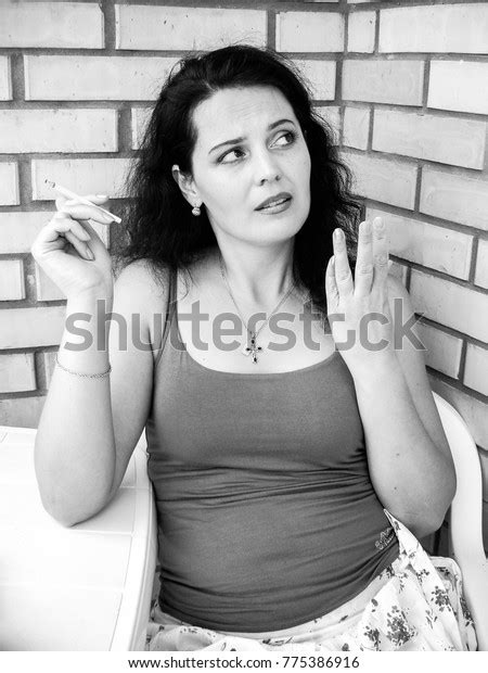 Mature Beautiful Brunette Woman Smoking Cigarette Stock Photo 775386916