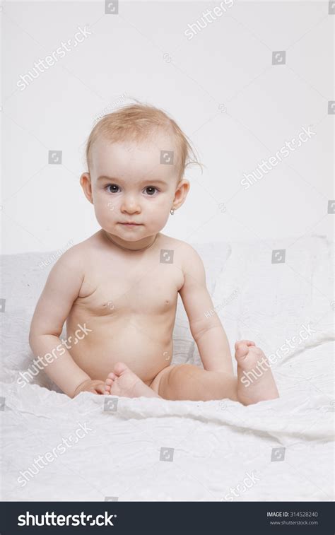 Babe Girl Sitting Naked On The White Bed On Royalty Free Stock Photo Avopix Com