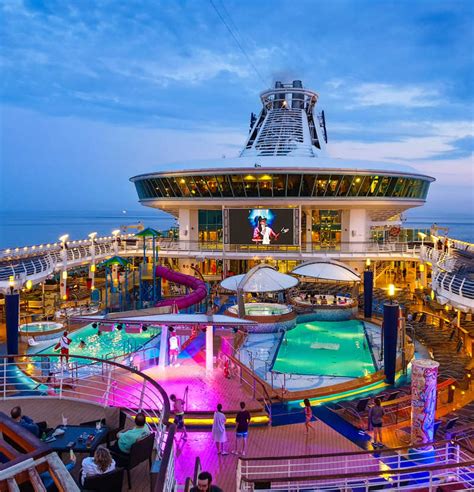 Royal Caribbean Cruise Pool Deck Lit Up At Night With Lights Travel