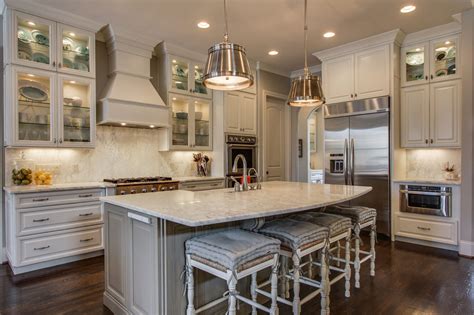 Shaker in willow gray on perimeter and ash with vintage glaze stain on island and hood @lilyanndesign with prostock kitchens. KITH Kitchens *** Custom Cabinets *** Cabinet Construction