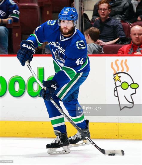 Matt Bartkowski Of The Vancouver Canucks Skates Up Ice With The Puck