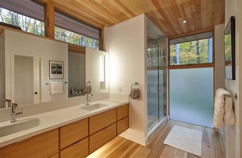 In This Contemporary Bathroom A Double Sink Wood Vanity With A White