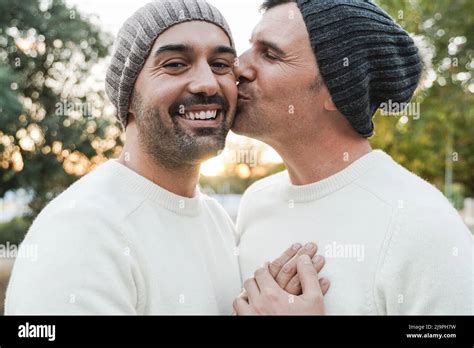 Mature Gay Men Couple Having Tender Moment Outdoor Focus On Left Man