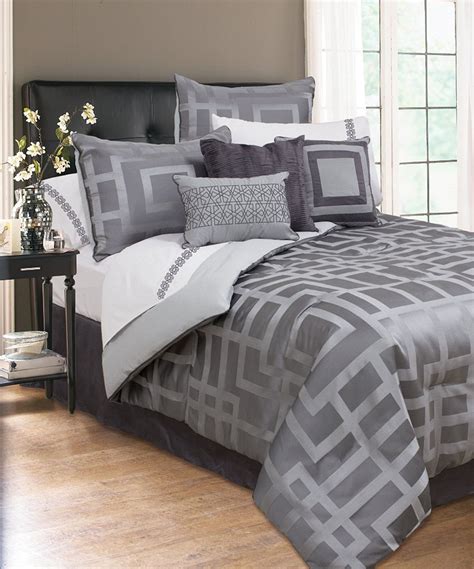 This comforter set features a feminine, shabby chic style with ruffled design. Take a look at this Gray Carleton Luxury Jacquard Seven ...