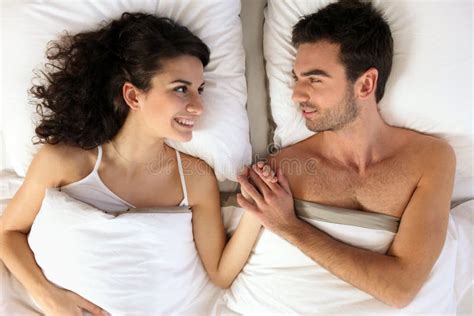 Couple Holding Hands In Bed Stock Image Image Of Awake Dreaming 21370411