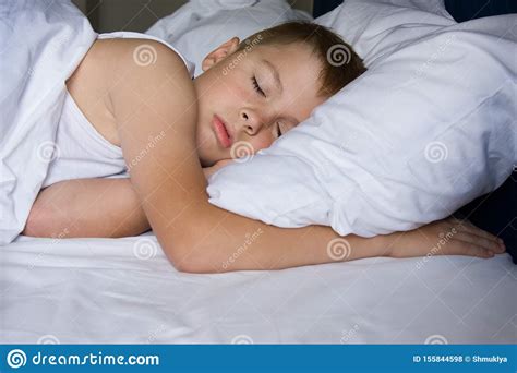 Tired Young Boy Sleeping In Bedroom Stock Photo Image Of Caucasian