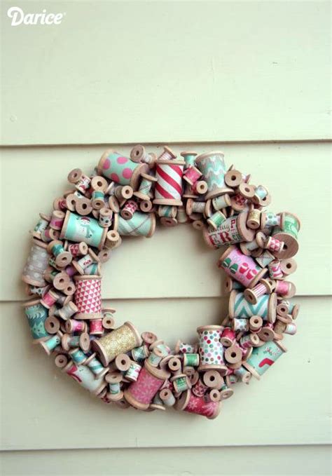 A Close Up Of A Wreath Made Out Of Buttons On A Wall With The Word Love