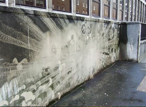 Reverse Graffiti Street Artists Paint Images On Walls By Scrubbing
