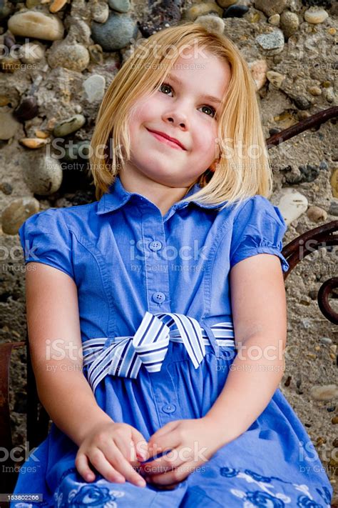 Pretty Little Girl Sitting Stock Photo Download Image
