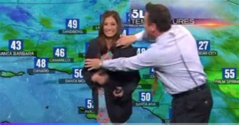 News Anchor Helps Weather Girl Cover Up Awkward On Air