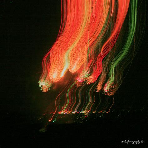 Long Exposure Photograph Of Red Green And Orange Lights In The Night