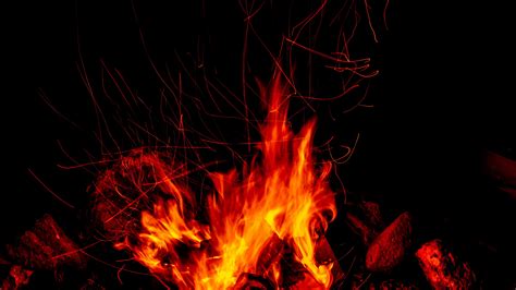 Download Wallpaper 3840x2160 Bonfire Fire Sparks Flame Dark 4k Uhd
